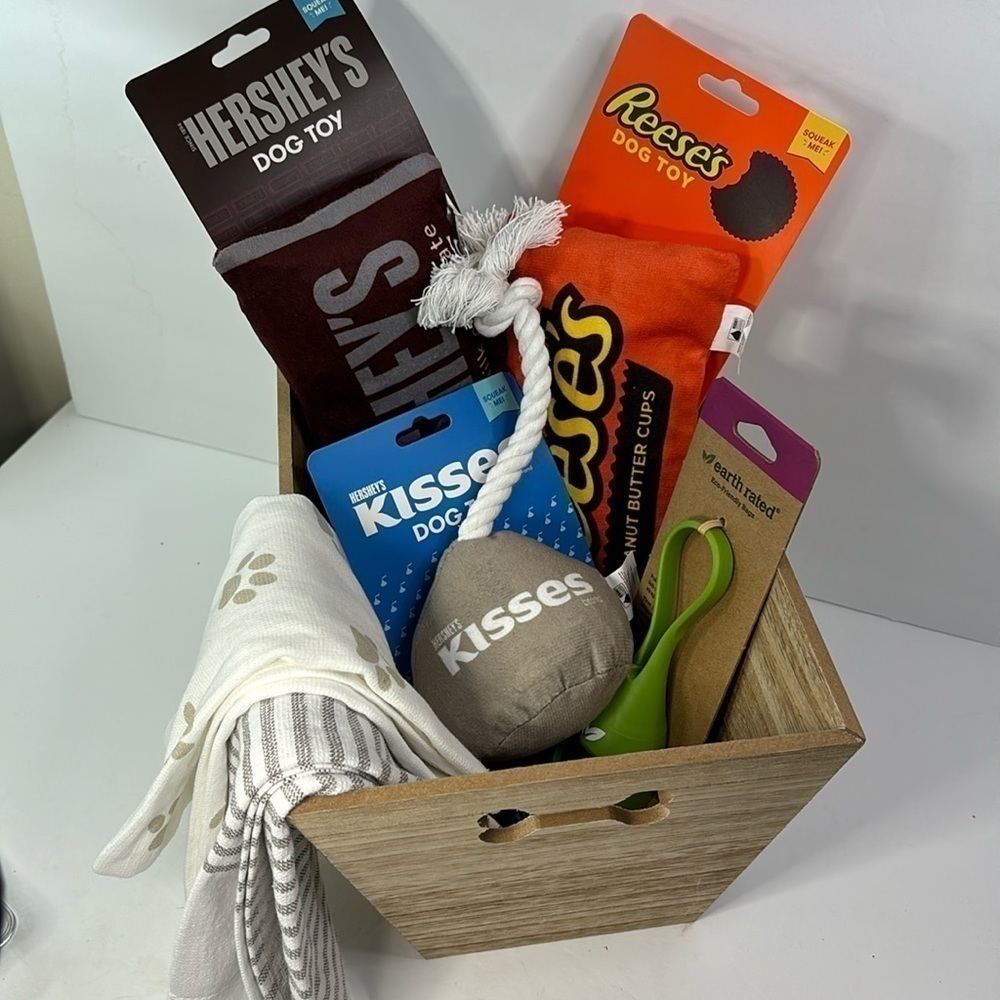 Dog gift basket with Hershey squeak toys, hand towels, and doggy waste bags